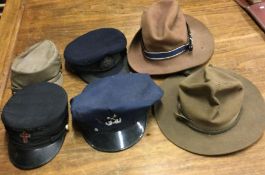 Five various Military hats. Est. £30 - £40.