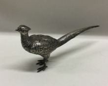 A large silver figure of a bird bearing import mar