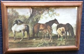 A framed and glazed print depicting horses by a st