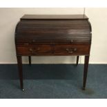 A Georgian cylinder top desk. Est. £100 - £200.