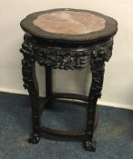A Chinese occasional table with marble inset. Est.