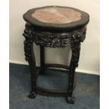 A Chinese occasional table with marble inset. Est.