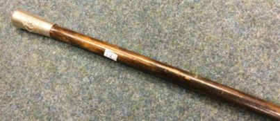 A World War II swagger stick. Est. £20 - £30.
