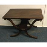 A mahogany occasional table on flowing supports. E