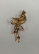 An attractive 9 carat brooch in the form of a bird