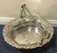 A fine George II pierced silver basket, the border cast