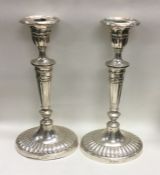 A large pair of Adams' style silver candlesticks o