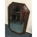 An oak wall mirror. Est. £20 - £30.