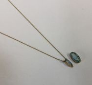 A Victorian blue stone drop pendant in gold mount.