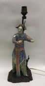 An unusual Chinese porcelain figure mounted as a l