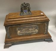 A large silver and enamelled oak casket with