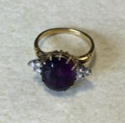 An Amethyst and diamond cluster ring. Approx. 9 gra