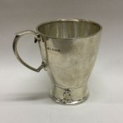 A silver christening mug chased with animals. Birm