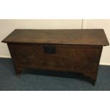 An Antique oak plank top coffer. Est. £80 - £120.