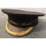 A station master's cap. Est. £10 - £20.