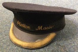 A station master's cap. Est. £10 - £20.