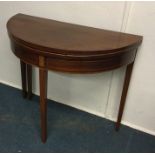 A Victorian fold over tea table. Est. £50 - £80.