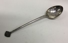 A large Chinese silver spoon with engraved bird an