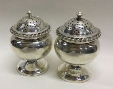 A pair of George III silver casters. Possibly Scot