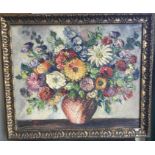 A gilt framed oil on board depicting a still life with flowers. Indistinctly signed to bottom right