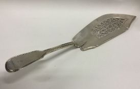 A heavy crested George III silver fish slice. Lond