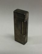 DUNHILL: A silver plated lighter. Signed to base.