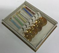 A set of six Norwegian silver and enamel spoons. A
