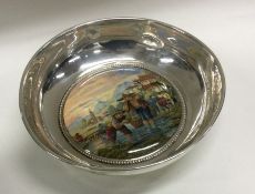 A rare silver bowl attractively decorated with Japanese scenes.