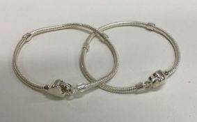 A pair of silver charm bracelets. Approx. 31 grams