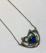 A stylish silver and enamelled pendant on fine lin