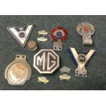 An old 'MG' badge etc. Est. £20 - £30.