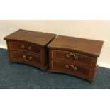 A pair of inlaid two drawer chests. Est. £20 - £30