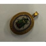 An attractive oval micro-mosaic pendant depicting