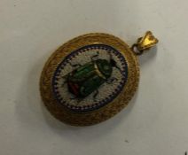 An attractive oval micro-mosaic pendant depicting