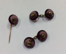 An attractive pair of amethyst and gold cufflinks