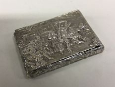 A chased silver hinged top box decorated with a ta