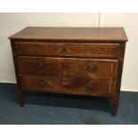 A rare Maggiolini chest of three drawers on taperin