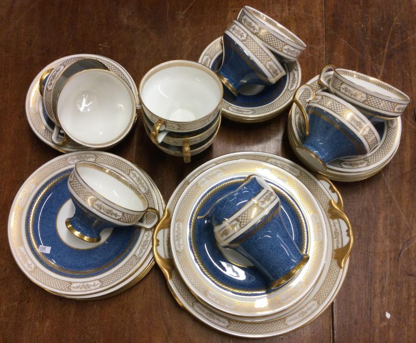 A Royal Doulton tea service in blue ground. Est. £