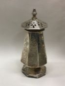 An early Victorian silver pepper with engraved dec