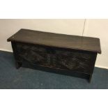 A good carved oak hinge top coffer. Est. £100 - £2