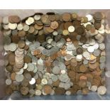 A box containing old coins. Est. £20 - £30.