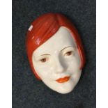 A stylish Royal Doulton face plaque decorated in b