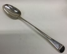 A large George III silver serving / basting spoon