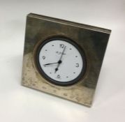 A silver desk clock. Retailed by Carrs of London. London. By Richard Comyns. Ap