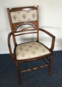 A Victorian inlaid chair. Est. £30 - £50.