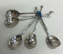 A set of five heavy silver coffee spoons decorated
