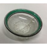 A silver and enamel rock crystal dish bearing impo