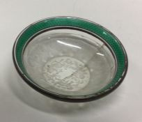 A silver and enamel rock crystal dish bearing impo