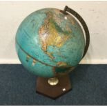 An old globe on stand. Est. £30 - £50.