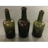 Three early hand blown wine bottles. Est. £10 - £2